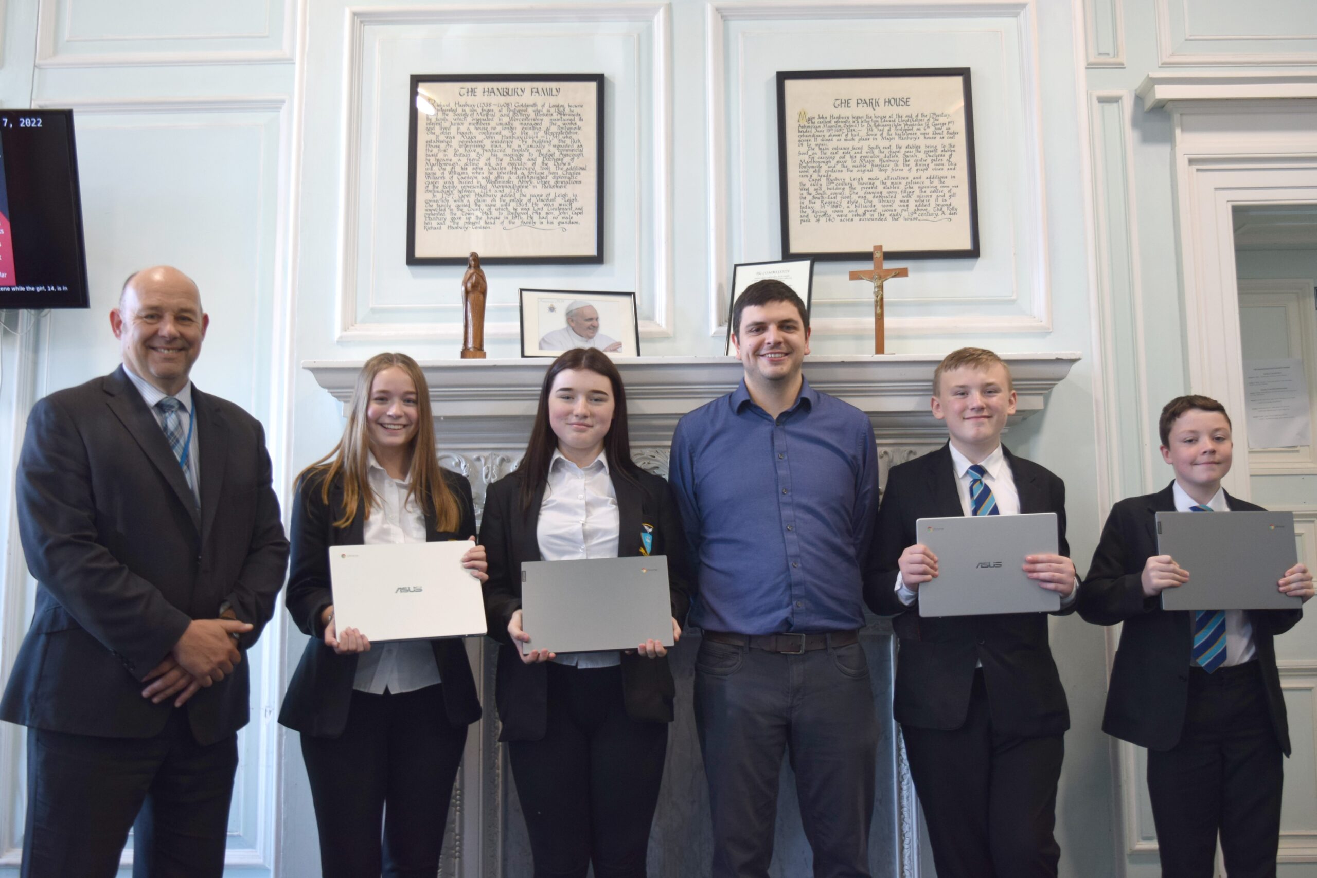 Convey Law Director Goes Back To School To Donate Much-Needed Laptops