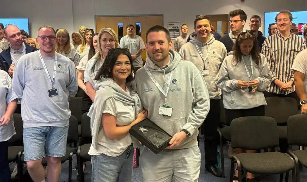 Alex Harris receiving an Award - Convey Law